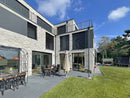 manufactured stone brick veneer loft dove B09DV 317901 installed on modern building outside wall