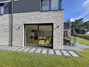 manufactured stone brick veneer loft dove handmade B09DV 317901 installed on modern building outside wall