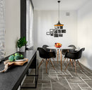 manufactured stone pavers Sienna ash Antique Pattern F01AS 317916 installed indoors dinner room with round table and 4 black chairs