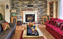 manufactured stone veneer slate look Sierra ash sand mixed handmade installed wall insidehouse-seats-fireplace-wooden-coffee-table