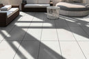 mayra white limestone 24x48 polished installed on patio view with modern outdoor furniture
