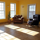 Oasis Gold travertine tile 18x18 10074413 Honed Filled sunroom with lake view